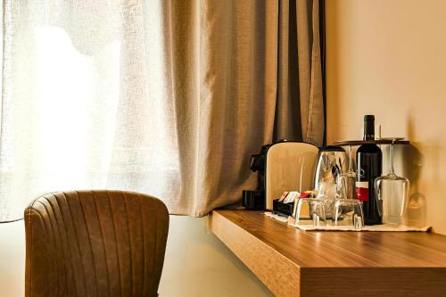 a wooden table with a coffee maker on top of it at Le Suite in Polistena