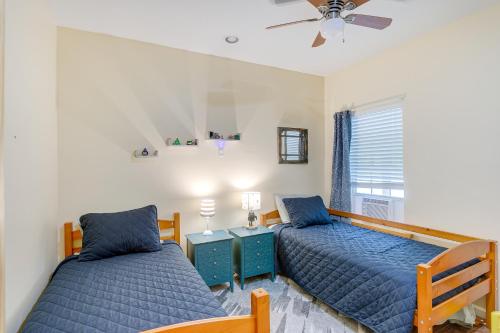 a bedroom with two beds and a window at Charming Darien Hideaway with Porch, Near Downtown! in Darien