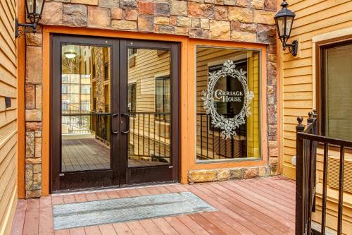 a front door of a house with a sign on it at Carriage House #215 in Park City