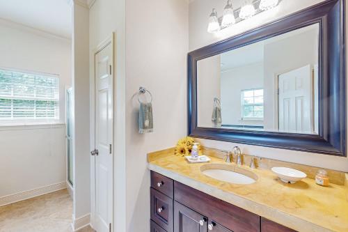 a bathroom with a sink and a mirror at Up a Lazy River in Shoreline Park