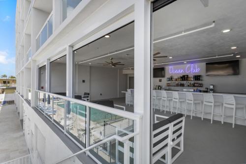 a view from the balcony of a beach resort with a bar at Ocean Club Treasure Island Hotel in St. Pete Beach