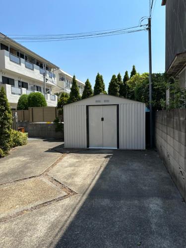 a garage with a white door in a parking lot at 东京晴空塔圈独栋别墅 in Tokyo