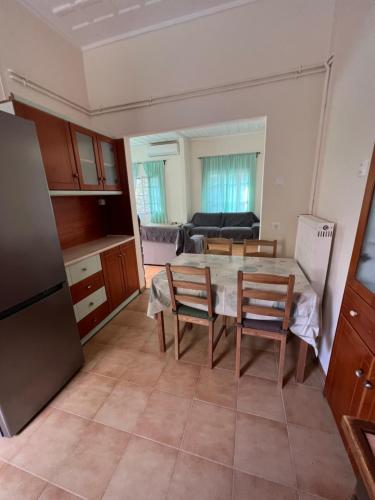a kitchen and dining room with a table and chairs at 90m2 2 Bedroom Apartment in Myrina Center - Port of Myrina in Myrina