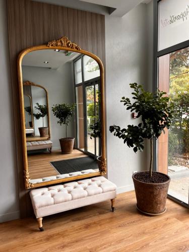 a mirror sitting on top of a bench in a room at Residhome Paris-Guyancourt in Guyancourt