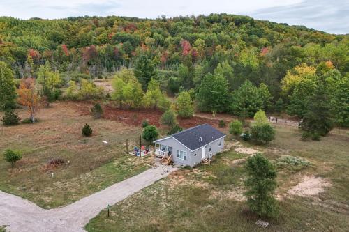 an aerial view of a white house in a field at Family Home in Rapid City about 4 Mi to Torch Lake! in Rapid City