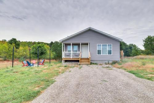 a small house with a porch and a driveway at Family Home in Rapid City about 4 Mi to Torch Lake! in Rapid City
