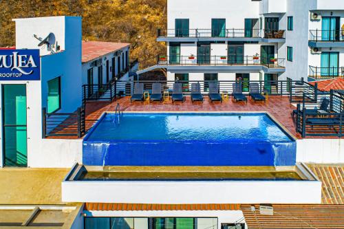 a swimming pool on top of a building at Morgan Residences 607B in Cabo San Lucas