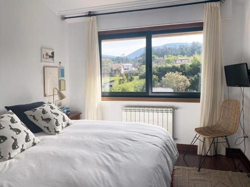 Postel nebo postele na pokoji v ubytování CASA CASTRO