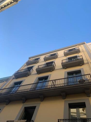 a building with balconies on the side of it at MN9 Tarraco in Tarragona