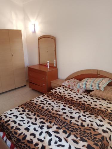 En eller flere senge i et værelse på Appartement meublé à Hammamet Nord