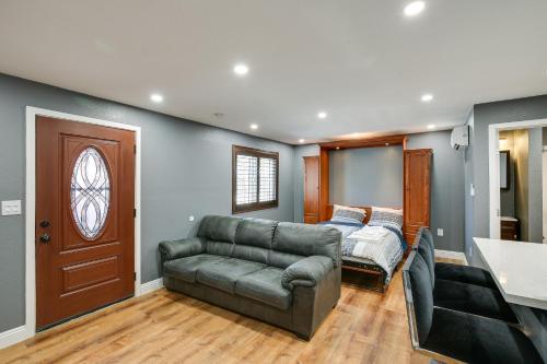 a living room with a couch and a bed at Hidden Gem in Hawthorne about 3 Mi to SoFi Stadium in Hawthorne