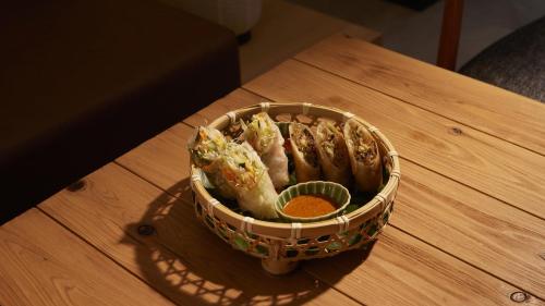 a basket of food sitting on top of a table at ASAI Kyoto Shijo in Kyoto
