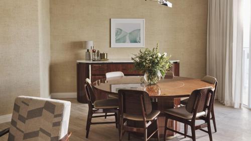 a dining room with a table and chairs at Four Seasons Hotel and Residences Fort Lauderdale in Fort Lauderdale