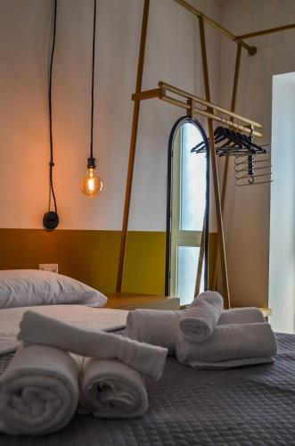 a room with two beds with towels on the floor at Scavi 32 in Ercolano