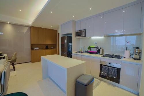 a kitchen with white cabinets and a counter top at GTC Luxury Top Floor Apartment, Nairobi in Nairobi