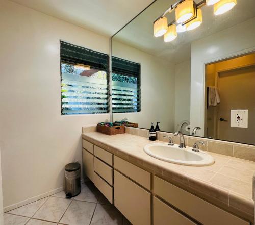 A bathroom at Urban Oasis: Stylish Mid-Century Home in Weho
