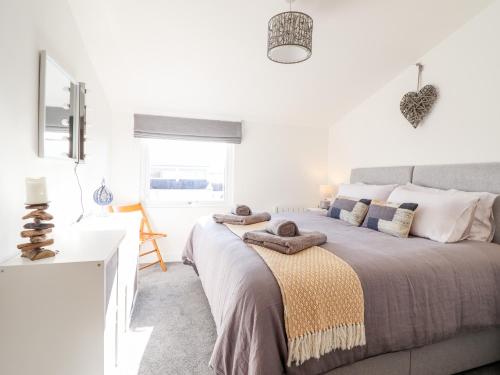 Postel nebo postele na pokoji v ubytování Sea Breeze