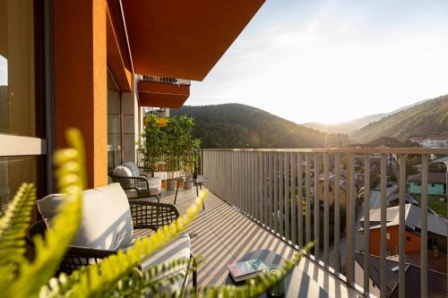 a balcony with a view of a mountain at Hedarom in Sinaia