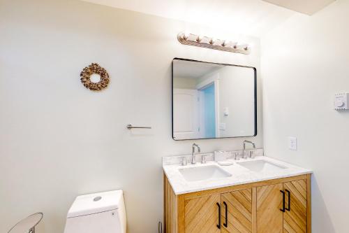 a bathroom with a sink and a mirror at Shorelands 44-2 in Kennebunk