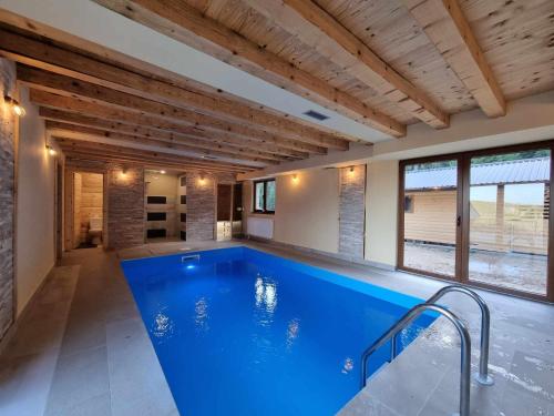 a large swimming pool in a house at Vila Suvo vrelo in Jahorina