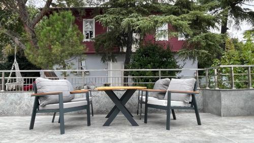 a table and two chairs sitting next to a table at Mona Bosphorus Hotel in Istanbul