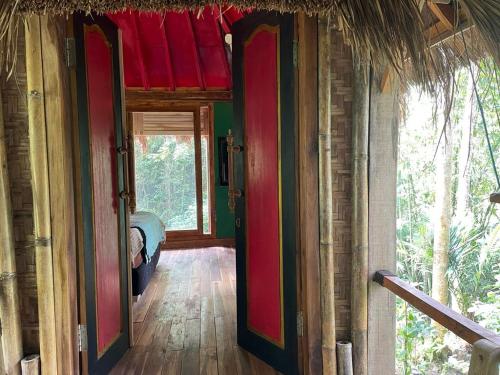 an open door to a room in a house at Satu Lingkung in Tetebatu