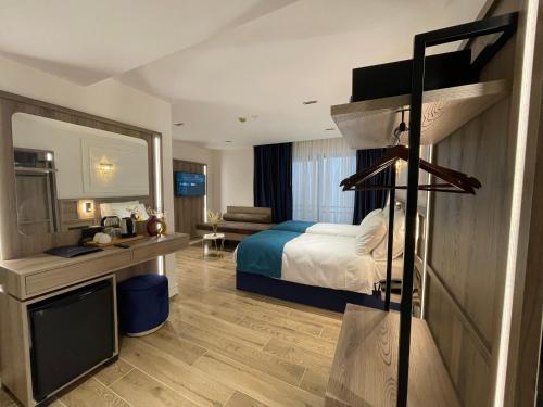 a hotel room with a bed and a desk at Mona Bosphorus in Istanbul