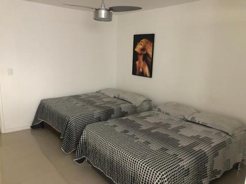 Katil atau katil-katil dalam bilik di Apartamento em Cabo Frio Temporada