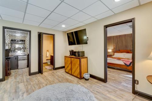 a hotel room with a bed and a mirror at Pet-Friendly Hickory Vacation Rental with Fire Pit! in Hickory