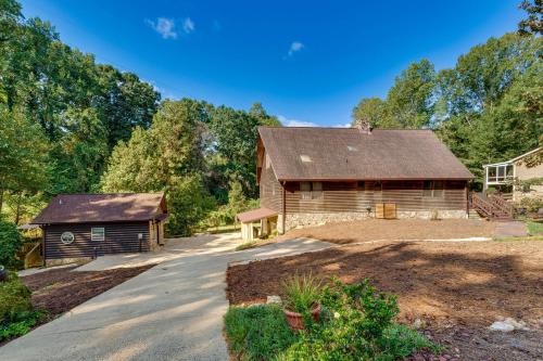 a home with a barn and a driveway at Pet-Friendly Hickory Vacation Rental with Fire Pit! in Hickory