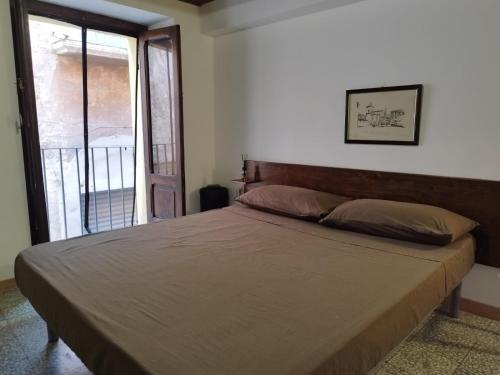 Ένα ή περισσότερα κρεβάτια σε δωμάτιο στο Casa Serena