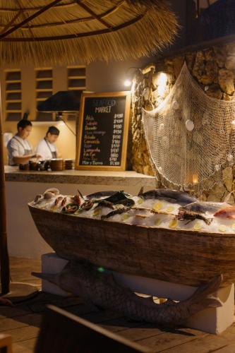 a bowl of food on a table in a restaurant at Cala de Mar Resort & Spa Ixtapa in Ixtapa