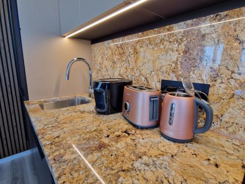 a kitchen with two toasters on a counter at 7thHeaven centre suite FREE PARKING in the building in Bratislava