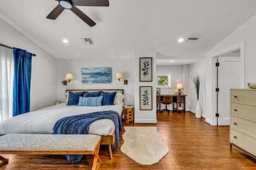a bedroom with a bed and a ceiling fan at Special Pricing, Las Olas Retreat, Heated Pool, Golf and Family-Ready in Fort Lauderdale