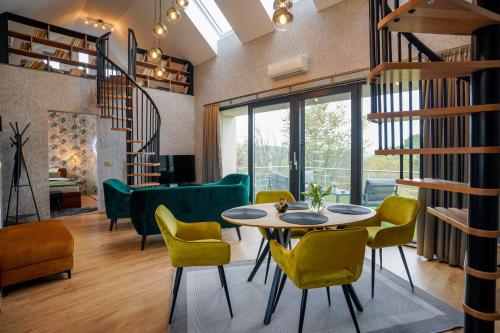 a living room with a table and chairs at Welcome House Eger in Eger