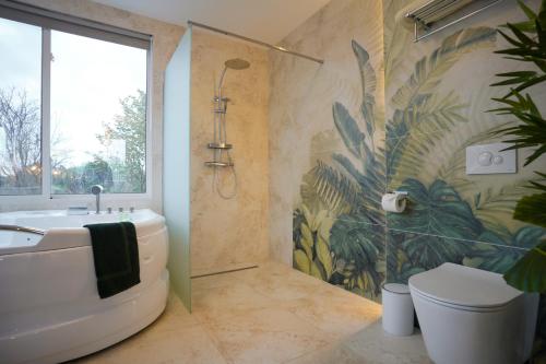 a bathroom with a shower and a sink and a toilet at Welcome House Eger in Eger
