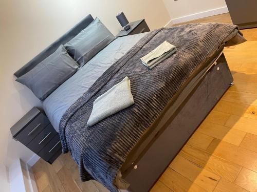 a large bed with two pillows on top of it at The Orchards in Elland