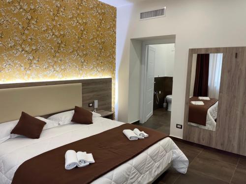 Postel nebo postele na pokoji v ubytování B&B La Villa Cittanova