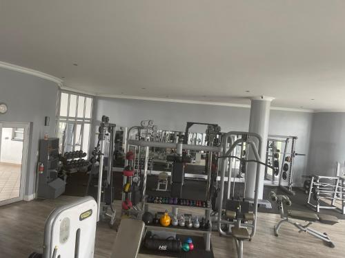 a room with a gym with a lot of equipment at Dream Abodes @ SPLICE RIVIERA in Johannesburg