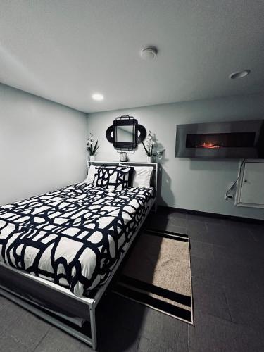 a bedroom with a bed and a tv on the wall at Chicago - Pilsen Studio apartment - Unit B in Chicago