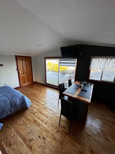 Hostal y Cabañas Mirando al Marにあるベッド