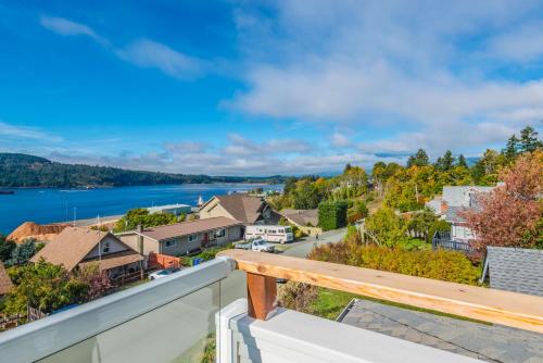 a view from the balcony of a house with a lake at Outdoor Lovers in Port Alberni