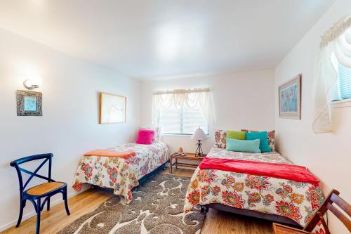 a bedroom with two beds and a window at Hazel Eyes in Nipomo