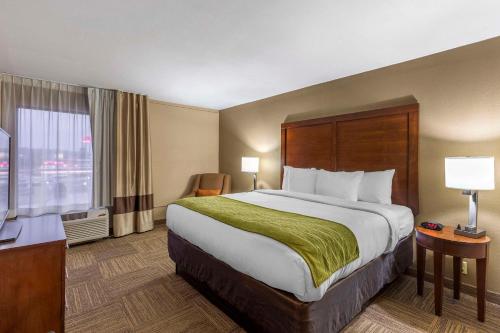 a hotel room with a large bed and a window at Comfort Inn Collinsville near St Louis in Collinsville