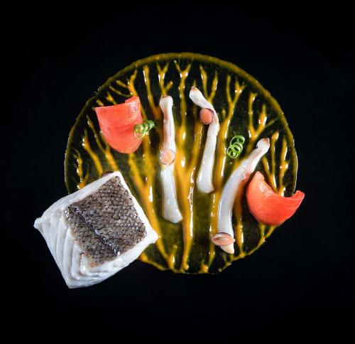 a plate of food with some food on it at NH Collection A Coruña Finisterre in A Coruña