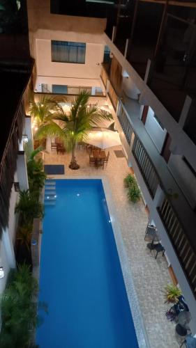 an overhead view of a swimming pool in a building at Hospedaje Ola Marina in Máncora