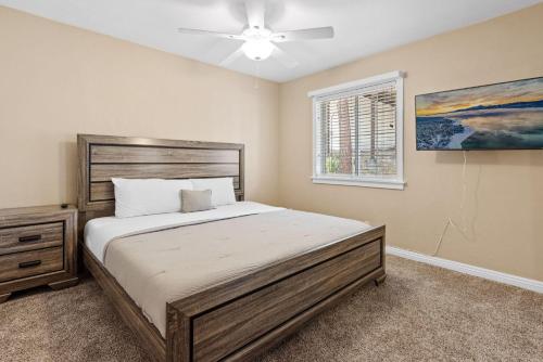 a bedroom with a large bed and a window at Paramount Paradise in Big Bear Lake