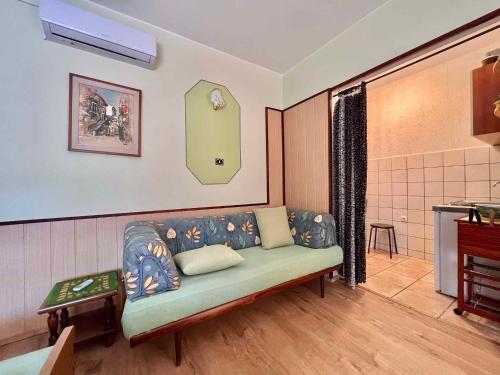 a living room with a couch in a room at Studio in Dramalj 45735 in Dramalj