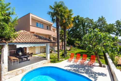 Seaside apartments with a swimming pool Njivice, Krk - 21421