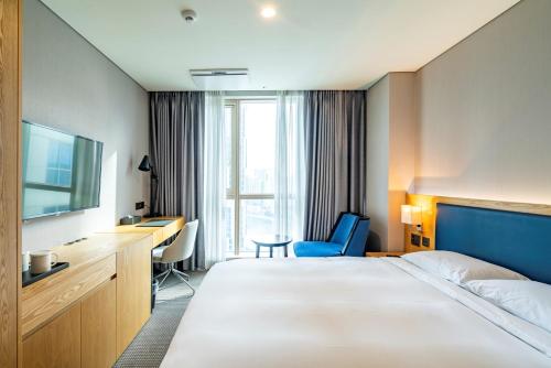 Postel nebo postele na pokoji v ubytování Centum Business Hotel